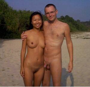 asian nudist friends - Nude teen friends play around at a public beach