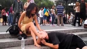 foot lick public - Gorgeous Brunette Babe Has A Guy Licking Her Feet In Public Video at Porn  Lib