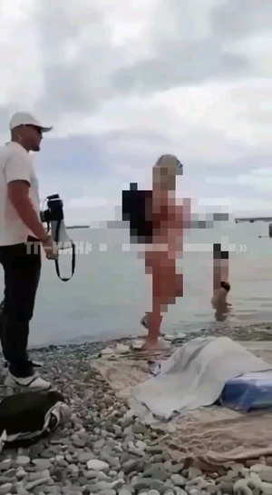 giant tits nudist beach sex - A woman got confused between a normal beach and a nudist beach and was  escorted out by security : r/ANormalDayInRussia