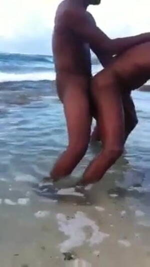 Black Gay Beach Fuck - Two black men having sex in the sea