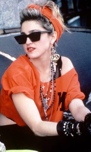 80s Madonna Porn - This 1980's look is an older style. A off the shoulder bright orange crop  top