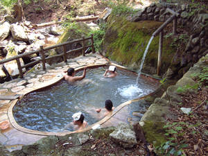 japanese public hot spring sex - In this undated photo, visitors bathe in Fudonoyu, an open-air onsen in