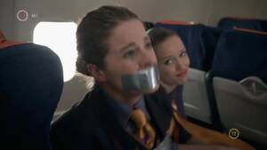 Airplane Bondage - BoundHub - Flight Attendant bound and gagged with duct tape