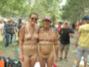 fat nudist camp - Young girl at a nudist festival with firm tits and shaved cunt posing with  older guy with fat shave dick
