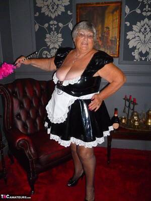 Grandma Maid Porn - Fat old maid Grandma Libby doffs her uniform to pose nude in stockings -  NakedPics