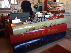 daniella steel's - Danielle Steel's desk...a giant stack of her own novels! Kind of badass for  the total ego trip that it is, but still utterly tacky & hideous. : r/ATBGE