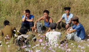 Korean Slave - A group of North Korean farm labourers work on a field in the country's  northwestern region. Photo: SCMP Pictures. â€œ