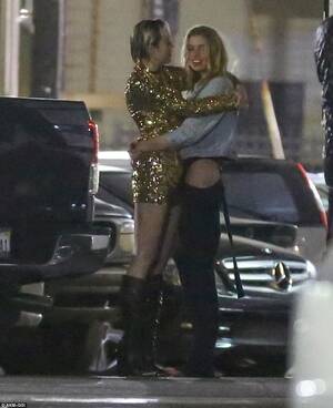 Miley Cyrus Kissing Porn - Miley Cyrus passionately kisses Victoria's Secret Angel Stella Maxwell  after coming out as bisexual | Daily Mail Online