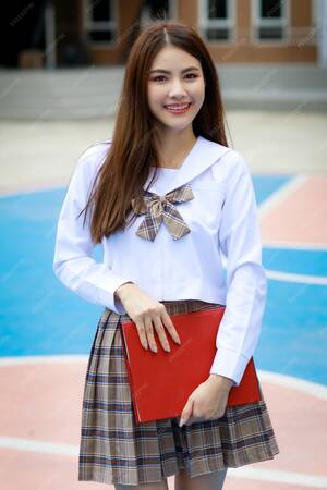 Asian Schoolgirl Uniform Sex - Premium Photo | Cute and young girl wearing japanese, korean style schoolgirl  uniform holding book
