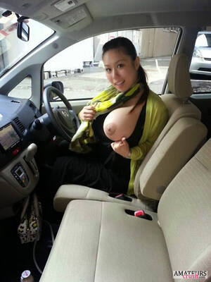 big tit asian car - Asian MILF flashing her big boob inside her car