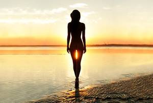 famous people on nude beaches - naked woman in the sunset