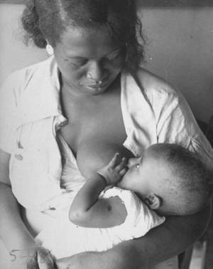 lactating black girl enslaved - {African-American mother breast-feeding her baby as she waits to see nurse