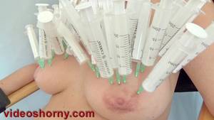 needle injection - ... Tortured girl filling her breasts and pussy lips with saline injections  nailing 40 syringes