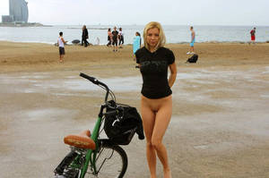Blonde Flashing Beach Porn - Bottomless blonde and a bicycle on the beach