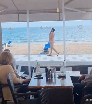couples posing naked beach - Bizarre moment man strolls totally naked through crowded Benidorm beach  leaving tourists stunned | The US Sun