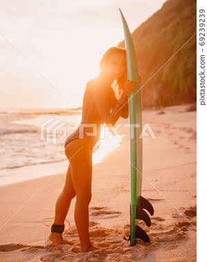 amateur hawaii naked beach pic - Naked slim surfing girl with surfboard on beach... - Stock Photo [69239239]  - PIXTA