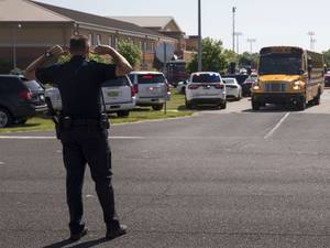 Middle School Bus Porn - PHOTO: An officer directs traffic following a shooting at Noblesville West Middle  School in Noblesville