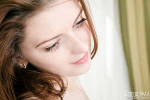 her lovely tits - Gorgeous long haired teen chick showing her lovely tits and sweet shaved  pussy on armchair.