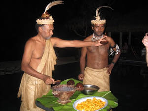 Melanesian Porn - Vanuatu men serving a dish in their traditional attire
