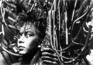 japanese horror movies xxx - man covered in machinery from tetsuo the iron man