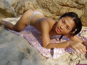 asian ladyboy bikini beach - Skinny asian ladyboy in tiny panties poses on the beach before swimming