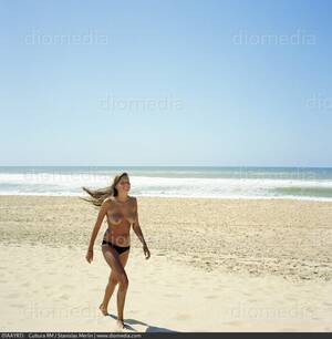 model walking on beach naked - STOCK IMAGE, , 15sm0138rm, 01AAYR7J , Cultura RM - Search Stock Photos,  Images, Pictures, Photography at Diomedia