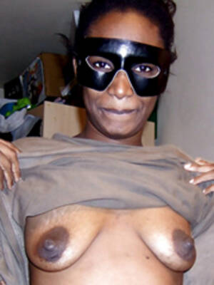 black ugly boobs - Ugly black female wearing a mask bares his saggy