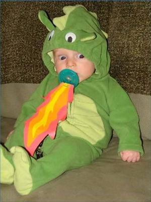 godzilla costumes - Adding flames to the pacifier was a brilliant move, turning this baby  dragon costume into a fire breathing dragon costume. Funny Photo of the day  for Monday ...