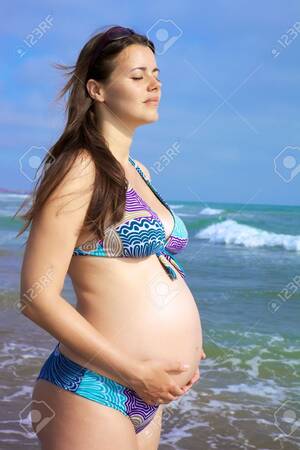 free junior nudist beach - Beautiful Pregnant Female Model Relaxing In Front Of The Sea Stock Photo,  Picture and Royalty Free Image. Image 14461729.