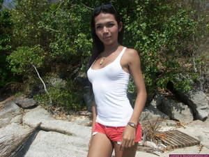 asian tranny beach sex - Very sexy Thai katoey flashing her boobies and her hard dick on the beach