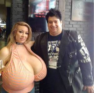 Fans Who Have Sex With Porn Star - A porn fan looks pleased as punch as he poses next to his sex icon
