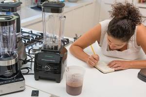 Blender Egg Porn - One of our testers taking notes at a kitchen counter.