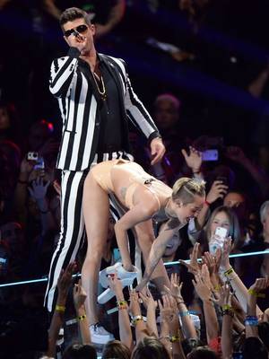 Miley Cyrus Robin Thicke Porn - Robin Thicke and Miley Cyrus perform onstage during the 2013 MTV Video  Music Awards. (Photo: Andrew H. Walker, WireImage)
