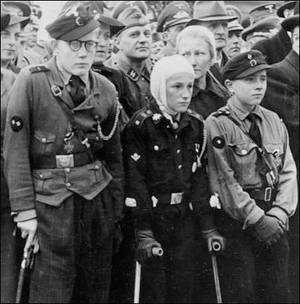 Boys Hitler Youth Camps Sex - On the German home front, HJ boys clean up the rubble after yet another air  raid. Below: Decorated HJ flak helpers are seen during a war rally held  amid ...