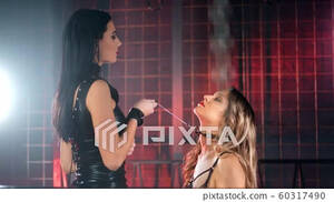 Mistress Lesbian Porn - Aggressive Asian girl in latex holding chain on... - Stock Footage  [60317490] - PIXTA