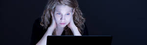 Girls Looking At Porn - Despair sad girl looking at computer's screen