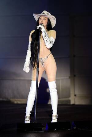 Miley Cyrus Porn Captions - Miley Cyrus' sister Noah strips almost naked in glittering sheer bodysuit  as she performs at CMT Awards â€“ The US Sun | The US Sun