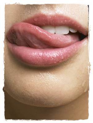 fellatio lips - woman licking her lips