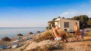 couples beach nude - The naturist couple that travels the world naked | CNN