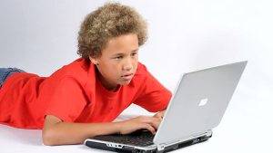 American Boy Porn - african-american-boy-types-email-on-laptop-computer-