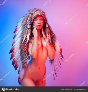 1800 Native American Cosplay Porn - Naked woman in native american costume with feathers on a neon background  Stock Photo by Â©artrotozwork 505801348