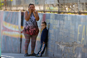 Middle School Student To Student Porn - Mother Elizabeth Acevedo and her son Andres, 3, wait for news of her son  Jose an eight-grader student at the Belmont High School in Los Angeles  Thursday, ...