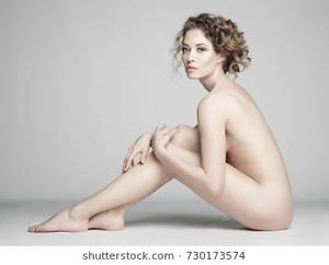 naked girl art nude - nude sexy beautiful woman with long stylish hairstyle pose on white  background in photostudio. Erotic