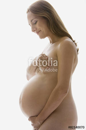 colombian pregnant nude - Nude pregnant Hispanic woman looking down