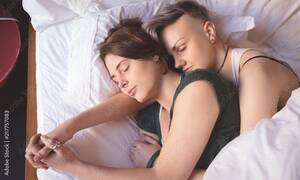 lesbians sleeping nude - Lesbian couple sleeping on bed in bedroom Stock Photo | Adobe Stock