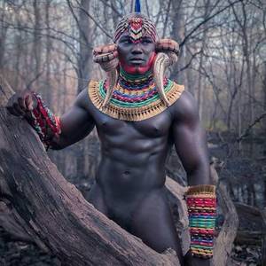 naked african king - beautiful man, but I am more interested in those wicked accessories -  African Fashion magazine