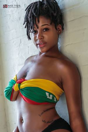 Jamaican Honeys Porn - stunning black woman makes bra from a flag(of Lithuania!) ankh tattoo  between very large breasts and cute locs