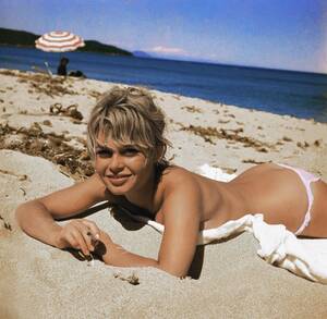 nude beach butt girl - Brigitte Bardot in the early 1960s starting the trend of topless sunbathing  : r/OldSchoolCool