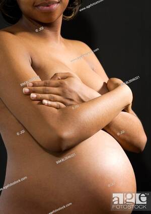 african american pregnant nude - Nude pregnant African American woman covering breasts, Stock Photo, Picture  And Royalty Free Image. Pic. BIM-BLD046321 | agefotostock