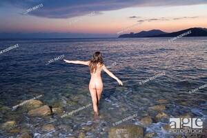 model walking on beach naked - Naked woman walking on the beach at sunset, Stock Photo, Picture And Rights  Managed Image. Pic. V51-904112 | agefotostock